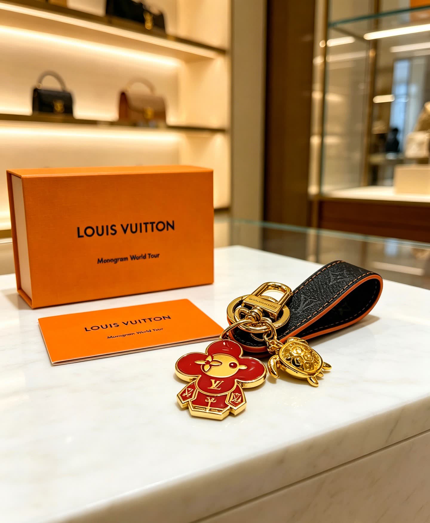 Louis Vuitton Leather Keychain with Flower and Turtle Charm